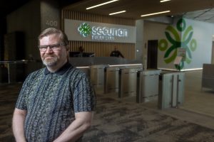 Scott standing in front of the Securian front desk.