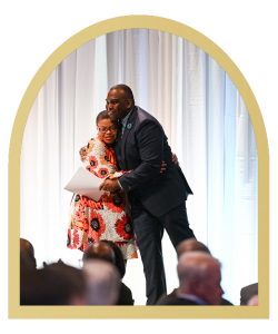 Our Emcee for the event, A.J. Hilton, and our special guest, Sheletta Brundidge, on stage together at the 2023 Annual Celebration.