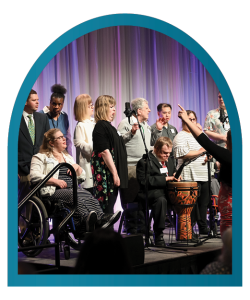 The Songbirds, a choir at Lifeworks, performing on stage at the 2023 Annual Celebration.